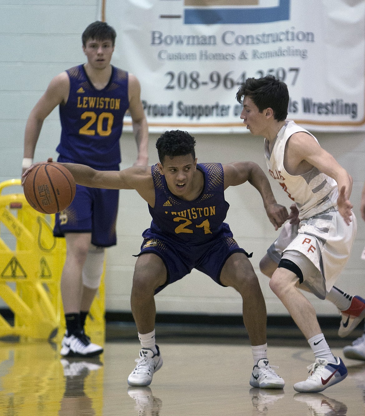 LISA JAMES/ PressDrake Thompson of Post Falls, right, tries to get the ball from Riley Way of Lewiston during their State 5A Region 1 championship game at Post Falls High School on Tuesday night. Post Falls lost to Lewiston, 48-51.