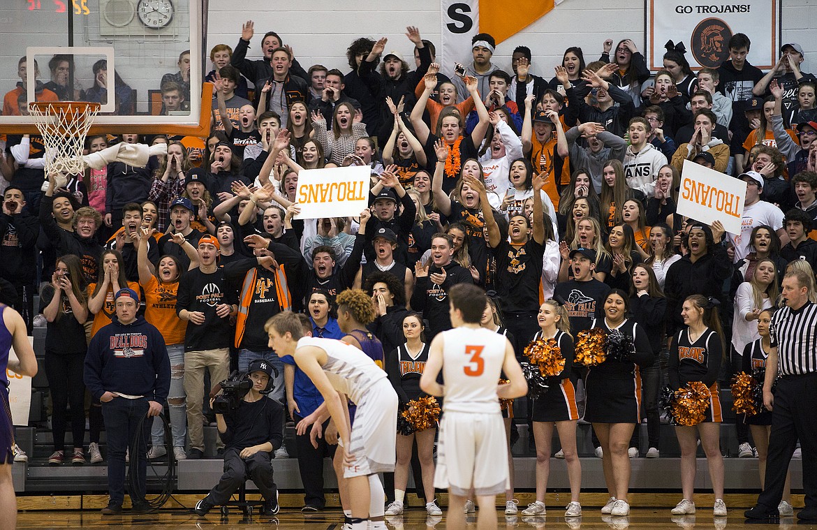 LISA JAMES/ PressPost Falls fans cheer players during the boys varsity State 5A Region 1 championship game against Lewiston at Post Falls High School on Tuesday night. Post Falls lost to Lewiston, 48-51.