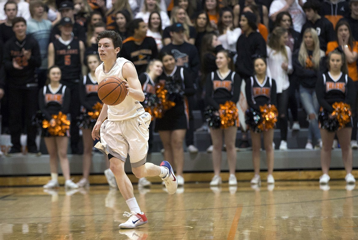 LISA JAMES/ PressDrake Thompson of Post Falls gets control of the ball during their State 5A Region 1 championship game against Lewiston at Post Falls High School on Tuesday night. Post Falls lost to Lewiston, 48-51.