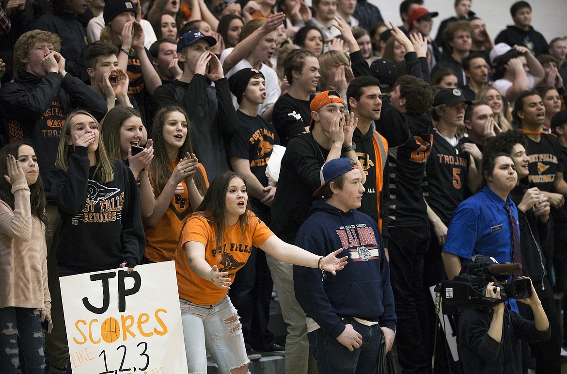 LISA JAMES/ PressPost Falls fans challenge a call during the boys varsity State 5A Region 1 championship game against Lewiston at Post Falls High School on Tuesday night. Post Falls lost to Lewiston, 48-51.