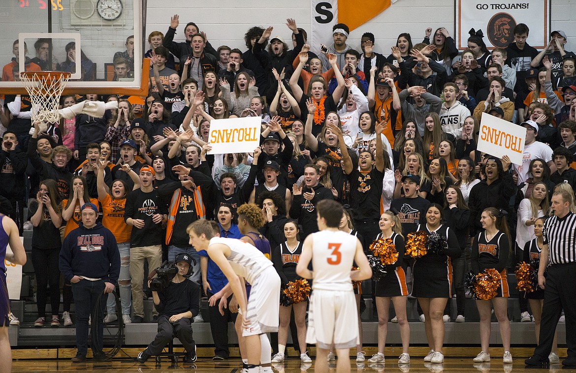 LISA JAMES/ PressPost Falls fans cheer players during the boys varsity State 5A Region 1 championship game against Lewiston at Post Falls High School on Tuesday night. Post Falls lost to Lewiston, 48-51.