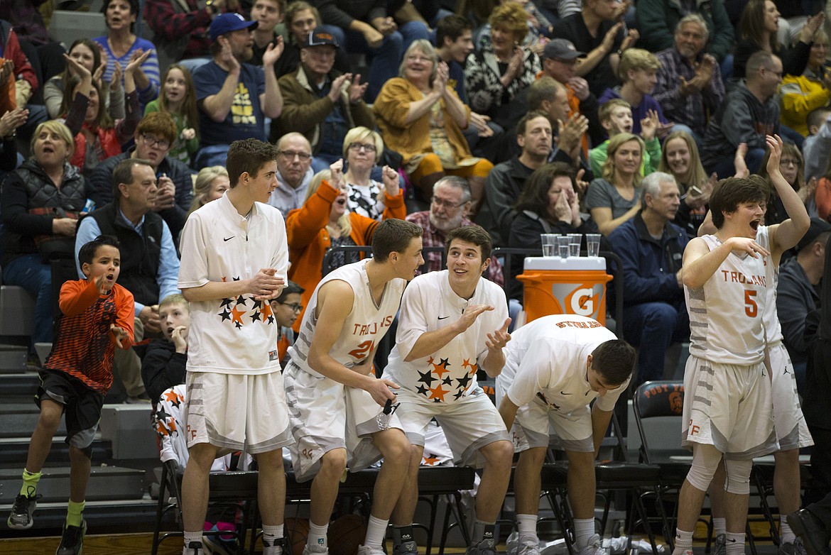 LISA JAMES/ PressPost Falls players celebrate during their State 5A Region 1 championship game against Lewiston at Post Falls High School on Tuesday night. Post Falls lost to Lewiston, 48-51.