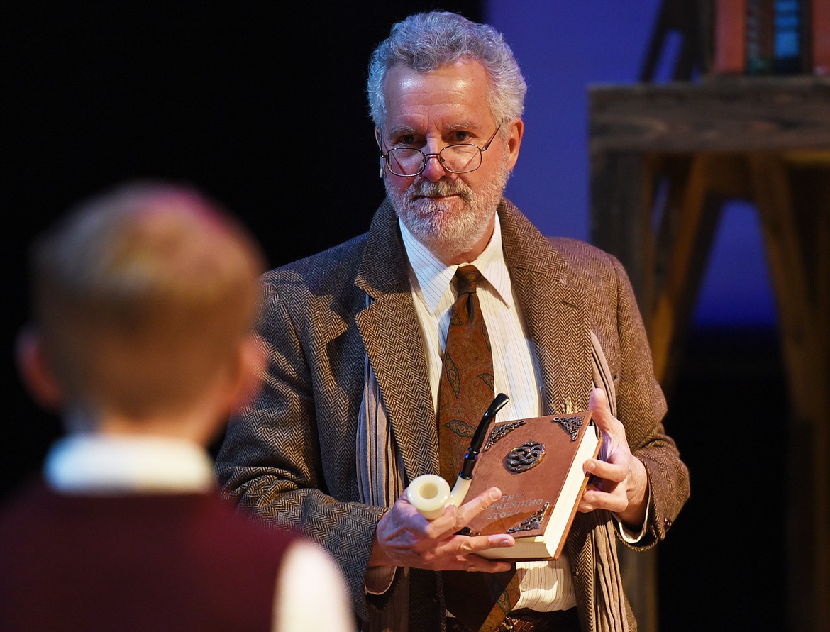 TONY HERNANDEZ, as the Bookseller, introducing Bastian, played by Meyer Fauth, to &#147;The Neverending Story&#148; in a dress rehearsal for the play Tuesday, Feb. 21, at the O&#146;Shaughnessy Center. (Brenda Ahearn/This Week in the Flathead)