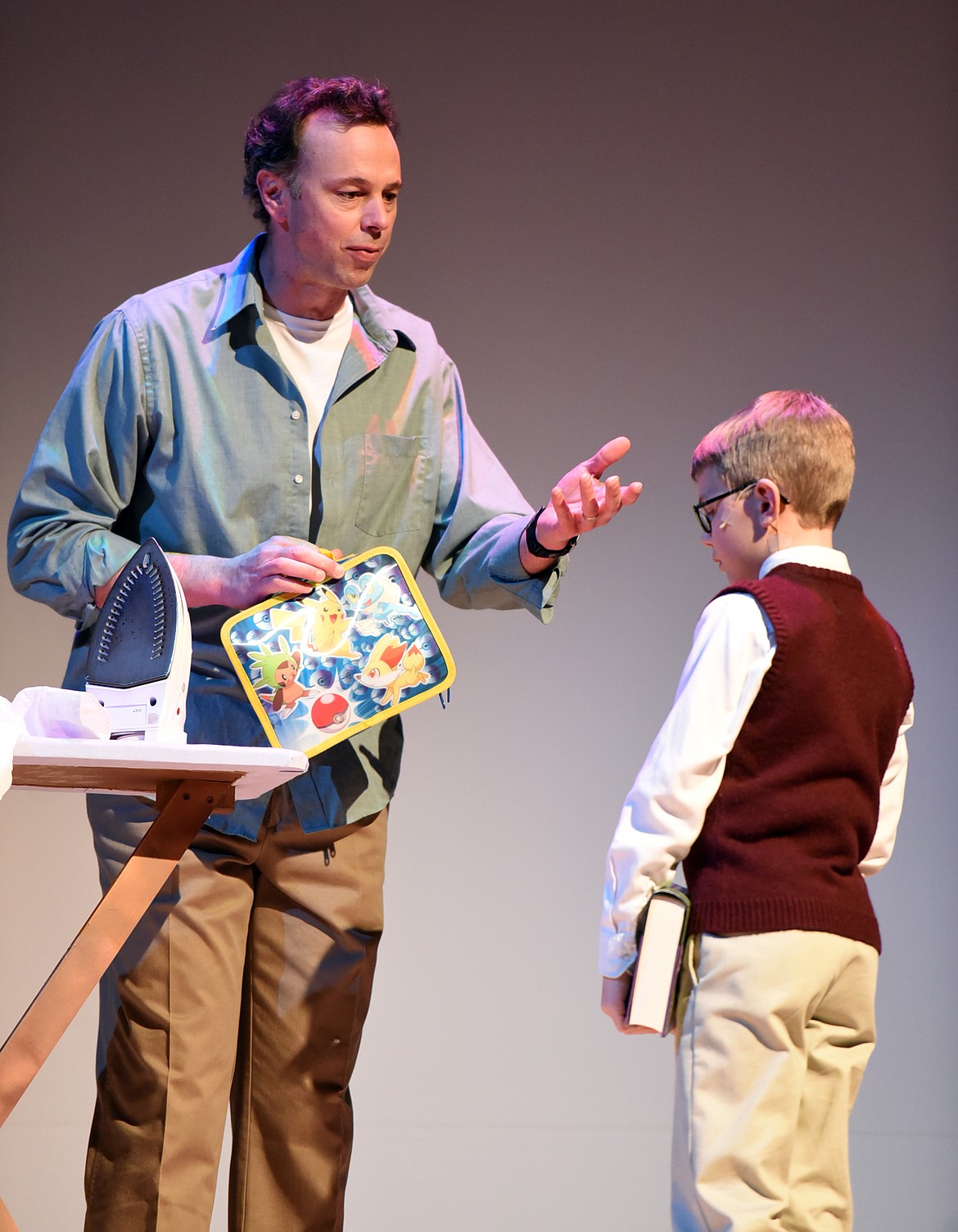 MATT FORD, as Bastian&#146;s father, talks with his son, played by Meyer Fauth, before the school day in a dress rehearsal for &#147;The Neverending Story,&#148; Tuesday, Feb. 21, at the O&#146;Shaughnessy Center. (Brenda Ahearn/This Week in the Flathead)