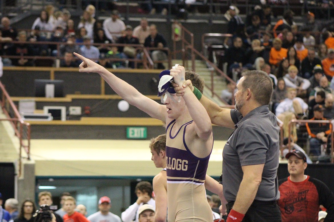 Photo by Stephanie Ivie
Tanner Figueroa has his hand raised by the official following his state championship win on Saturday afternoon in Boise.