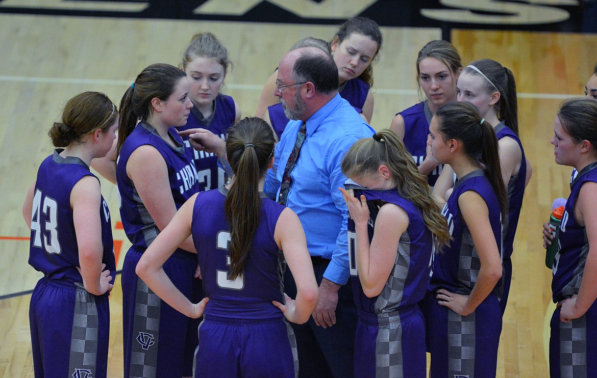 CHARLO HIGH School coach Brett Thompson discusses strategy during a fourth quarter timeout of the Western Class 14C Divisional Challenge game against St. Regis Monday night at the Ronan Events Center. The Lady Vikings' loss officially ended the team's successful season. (Jason Blasco/Lake County Leader)