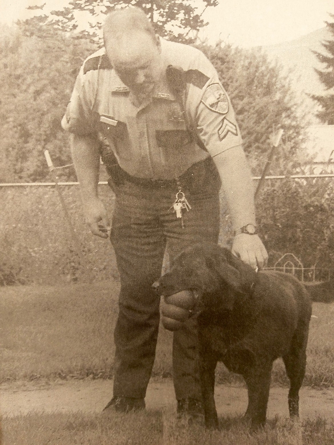 Sheriff Gunderson (then deputy) with deputy Zipper featured in a 1998 edition of the Shoshone News-Press announcing Zipper's retirement.