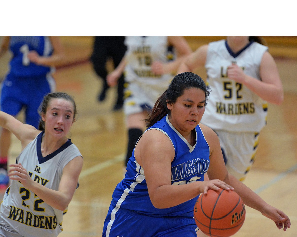 MISSION FORWARD Ran&#146;Dee Charlo takes the basketball to the hoop in transition against Deer Lodge in the second half of Thursday night&#146;s Western Class 6B Tournament at Hamilton High School.