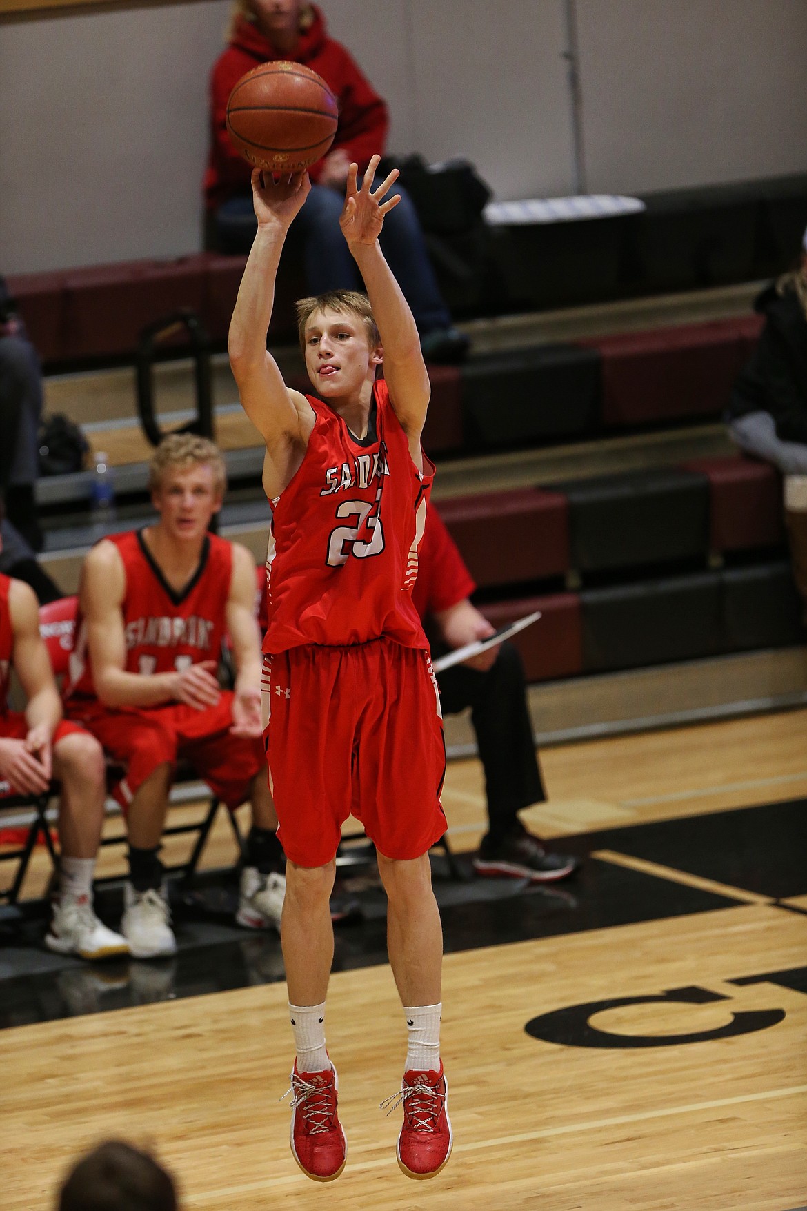 (Photo by JASON DUCHOW PHOTOGRAPHY)
Sandpoint freshman Ryan Roos launches a 3-point attempt in the Bulldogs&#146; loss to Lakeland at North Idaho College.