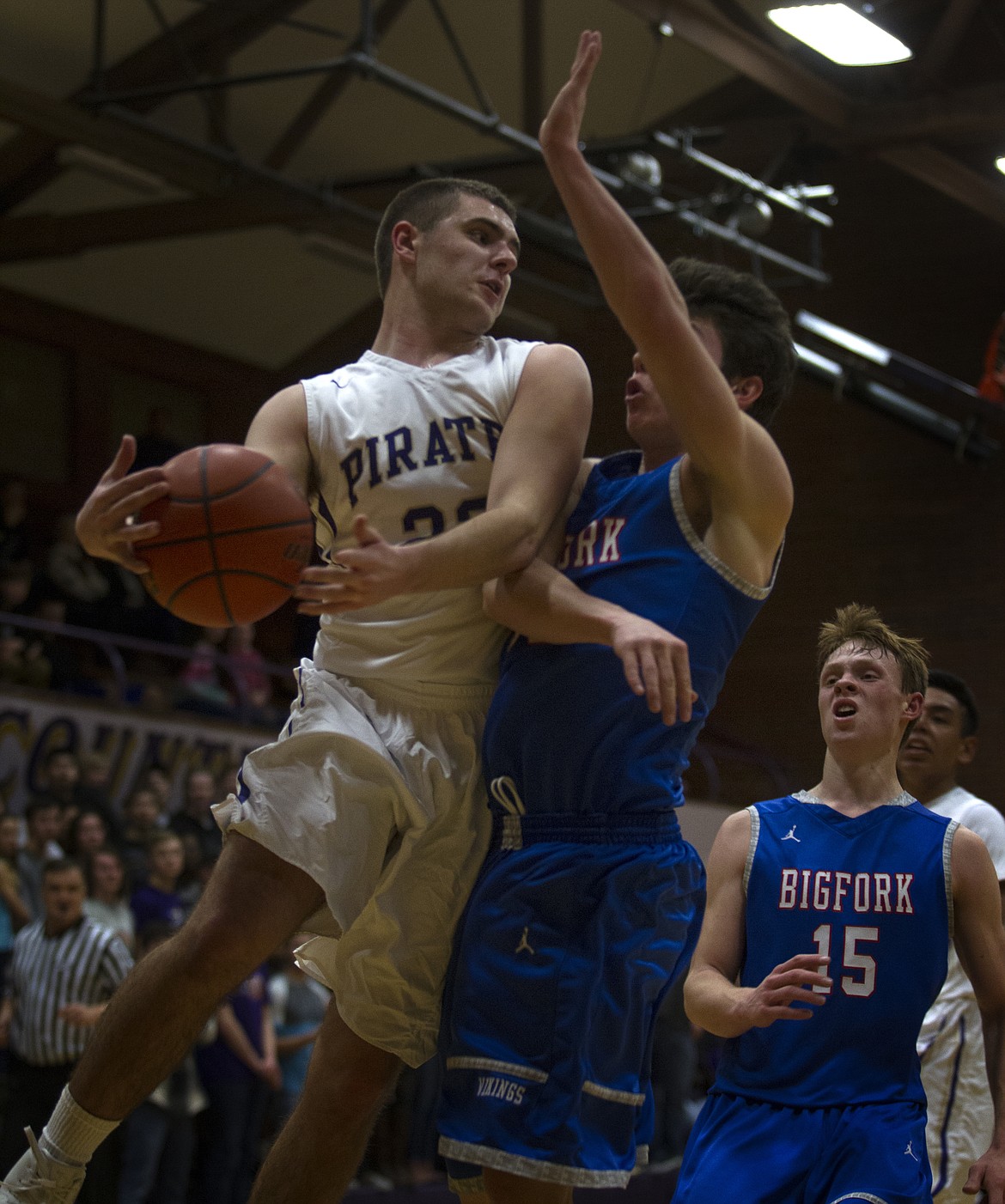 POLSON GUARD Tanner Wilson grabs a rebound against a Bigfork defender in the Feb. 9 contest at Linderman Elementary School. Wilson, one of the Pirates&#146; key defenders, will be a critical piece as the Pirates get ready to play in the first round of the Class A Divisionals against Corvallis. (Jeremy Weber/Lake County Leader)