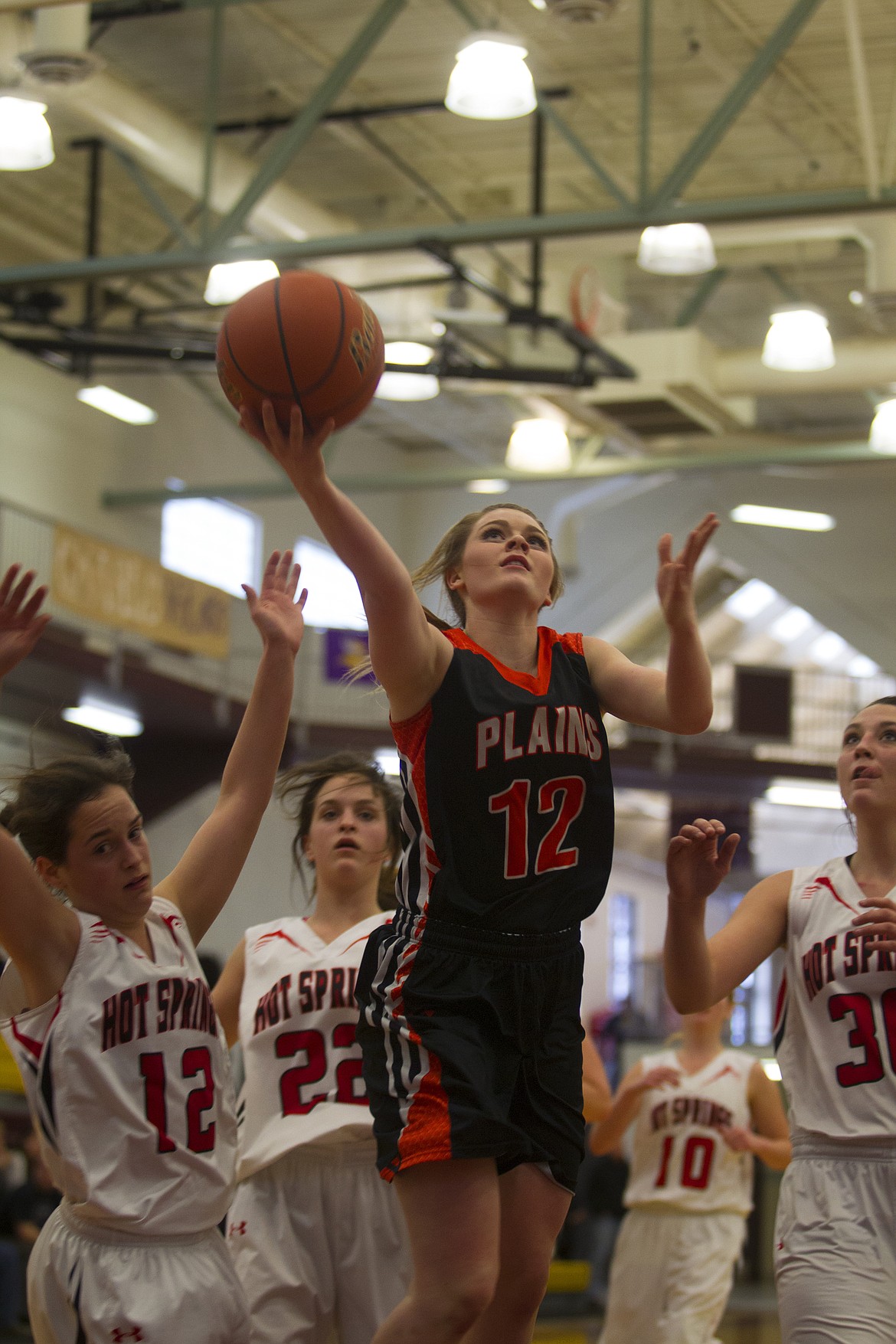 Lindsay Laws (12) goes up for a layup against Hot Springs in the opening round of the District 14C Tournament in Pablo Thursday. (Jeremy Weber/Clark Fork Valley Press)