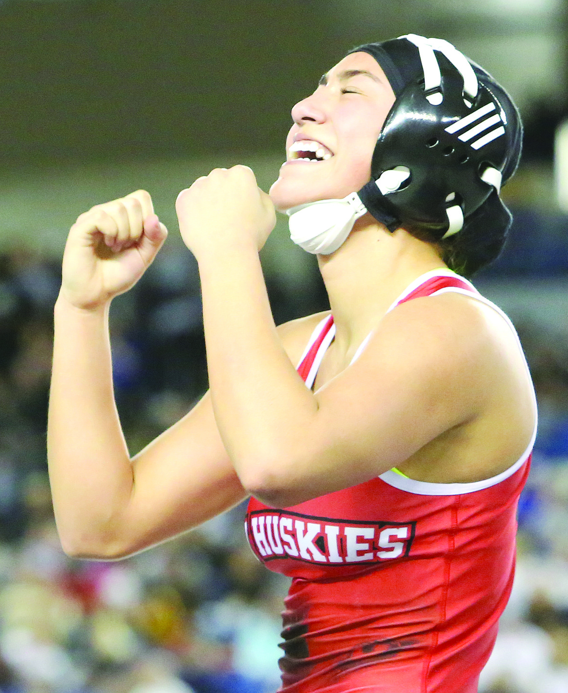 Connor Vanderweyst/Columbia Basin Herald - Othello's Nikki Velazquez celebrates after punching her ticket to the state 130-pound finals.