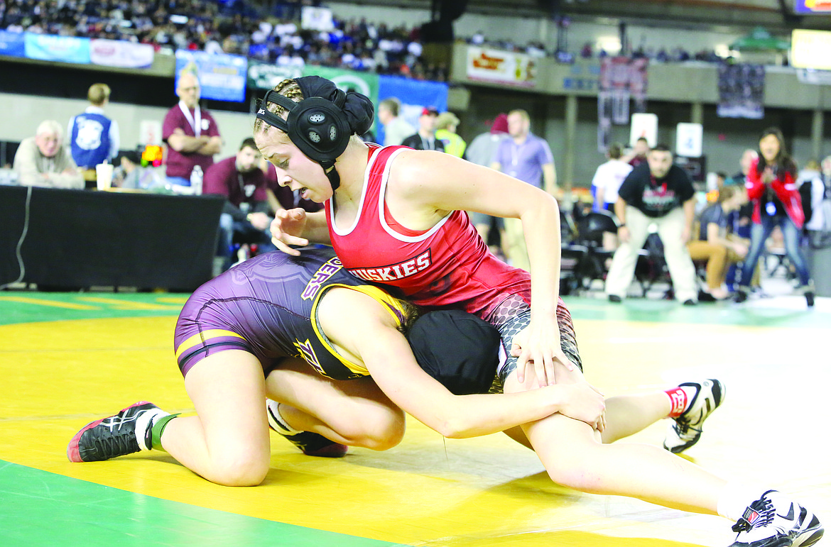 Connor Vanderweyst/Columbia Basin Herald - Othello's Kaylee Martinez works to take down Thomas Jefferson Jasmine Pleasants.