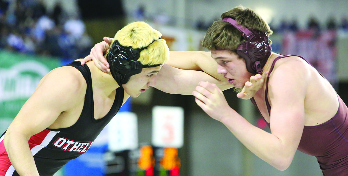 Connor Vanderweyst/Columbia Basin Herald - Othello's Reese Jones wrestles White River's Ryan Redford in the 170-pound finals.