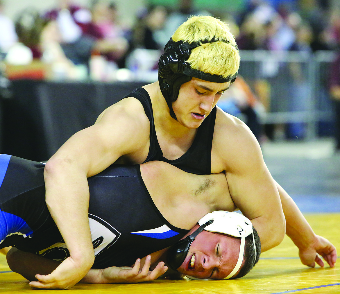 Connor Vanderweyst/Columbia Basin Herald
Othello&#146;s Reese Jones works to pin his opponent in the semifinals.