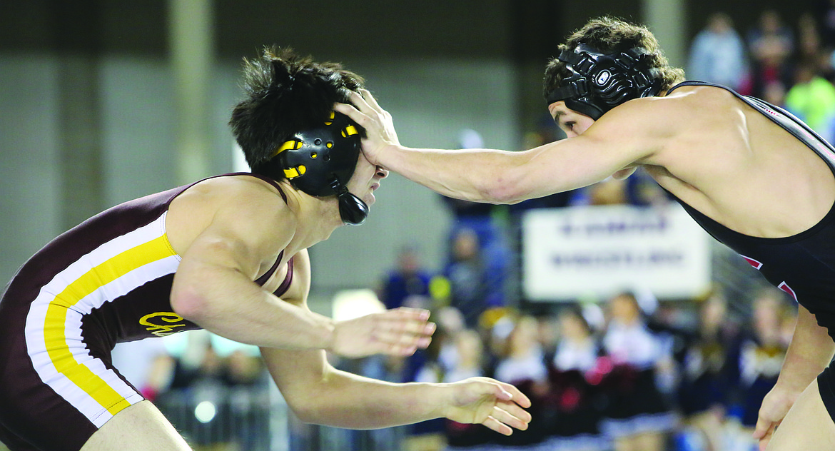 Connor Vanderweyst/Columbia Basin Herald
Moses Lake&#146;s Nick Hara (left) takes a shot to the head.