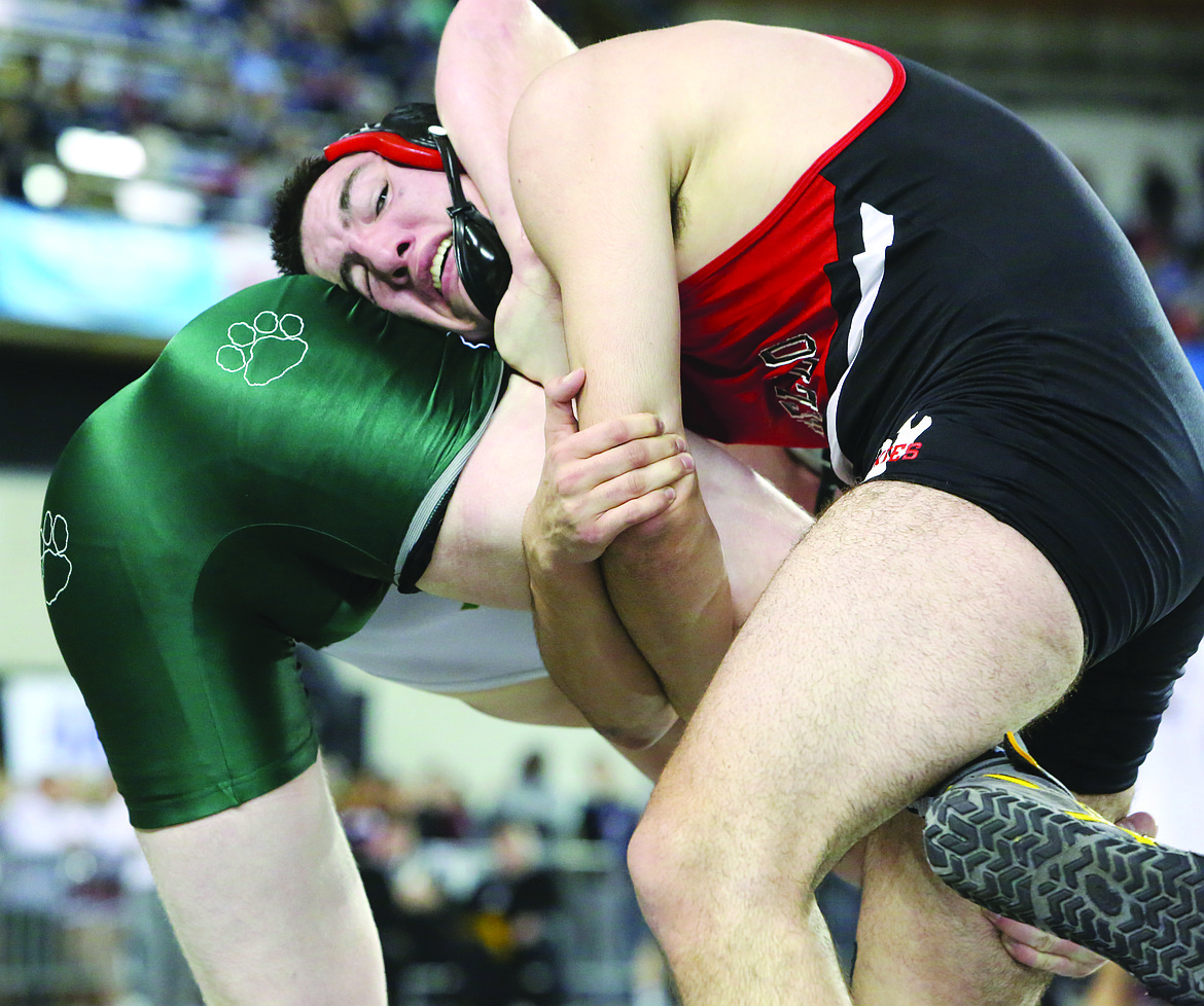 Connor Vanderweyst/Columbia Basin Herald
Othello&#146;s T.J. Martinez hangs on to win the 195-pound championship.