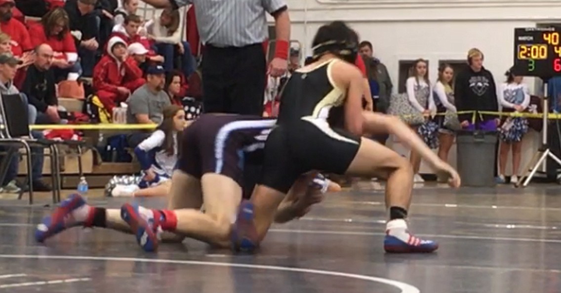 Ted Escobar/The Sun Tribune - Royal freshman Lorenzo Myrick starts to turn his first opponent over for a pin in the 152-pound class. He finished third and made it to state.