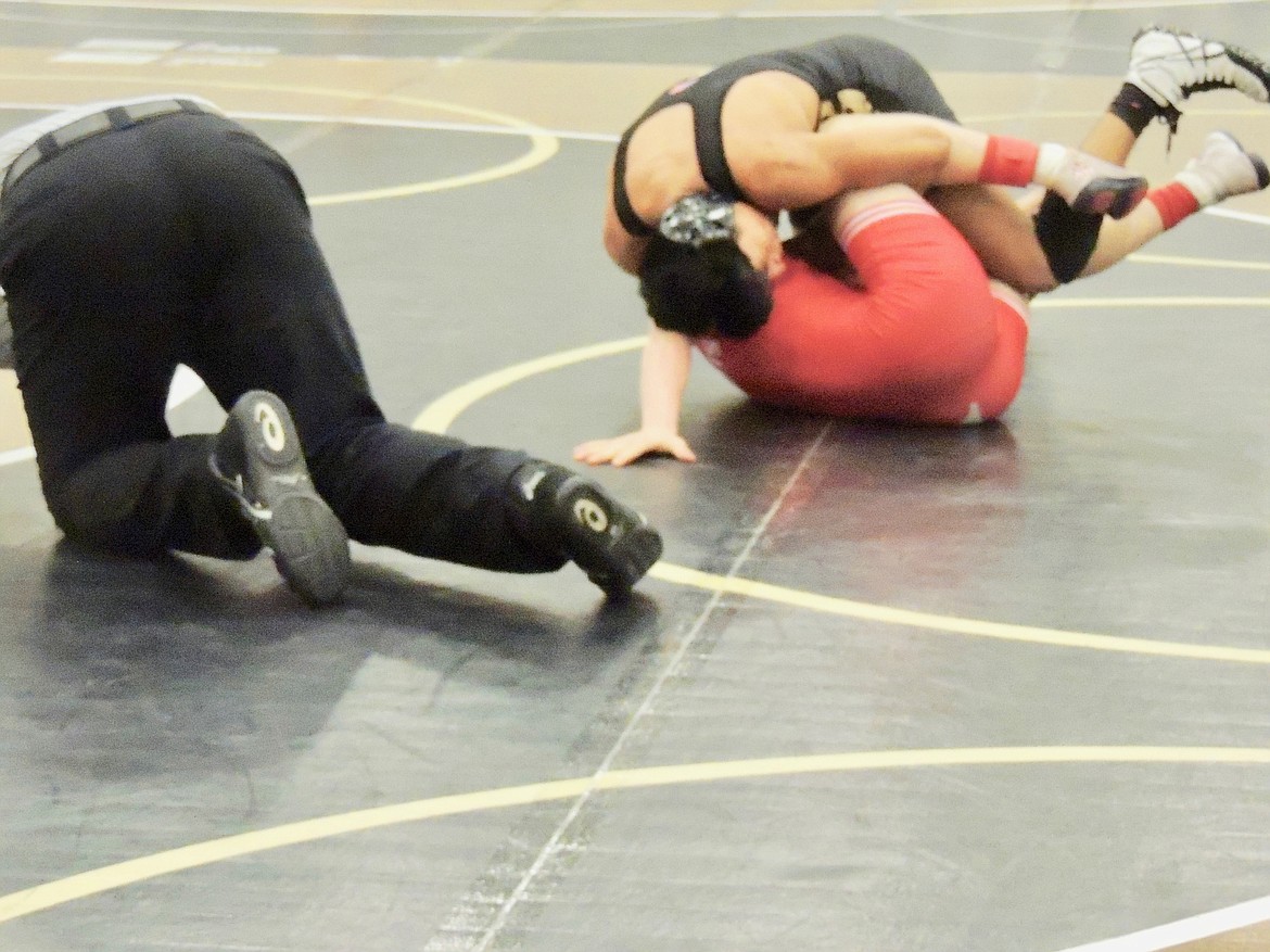 Ted Escobar/The Sun Tribune - Royal&#146;s Kevin Pastor scores a first round pin en route to third place at 138 pounds.