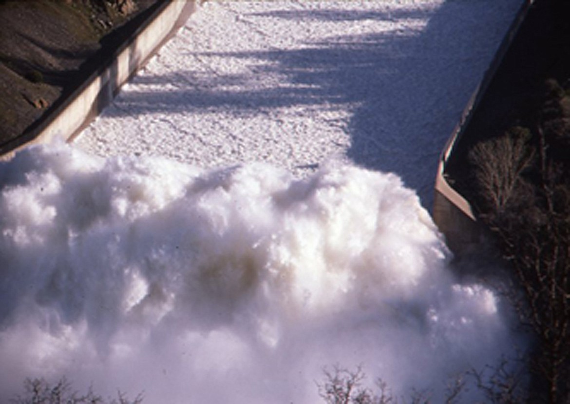 The base of the Oroville Dam spillway in 1986, where floodwaters from the lake empty into the river at the bottom of the dam. Former Oroville Police Chief Gary Grant said the force of the water rendered the road on the other side impassable.