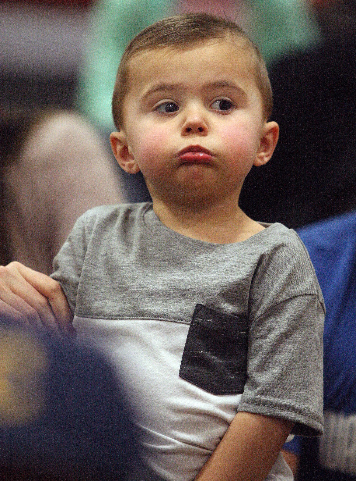 Rodney Harwood/Columbia Basin Herald
Two-year-old Tayton Jaderlund of Warden takes in the action at the SCAC District tournament at Zillah Alumni Gym on Saturday.
