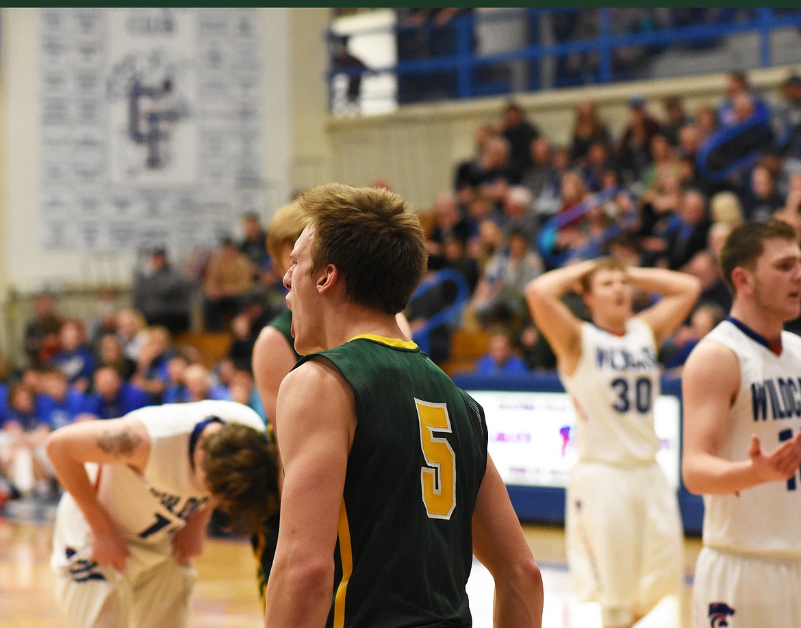 Derek Kastella celebrates after a layup late in Thursday&#146;s win against Columbia Falls. (Daniel McKay photos/Whitefish Pilot)