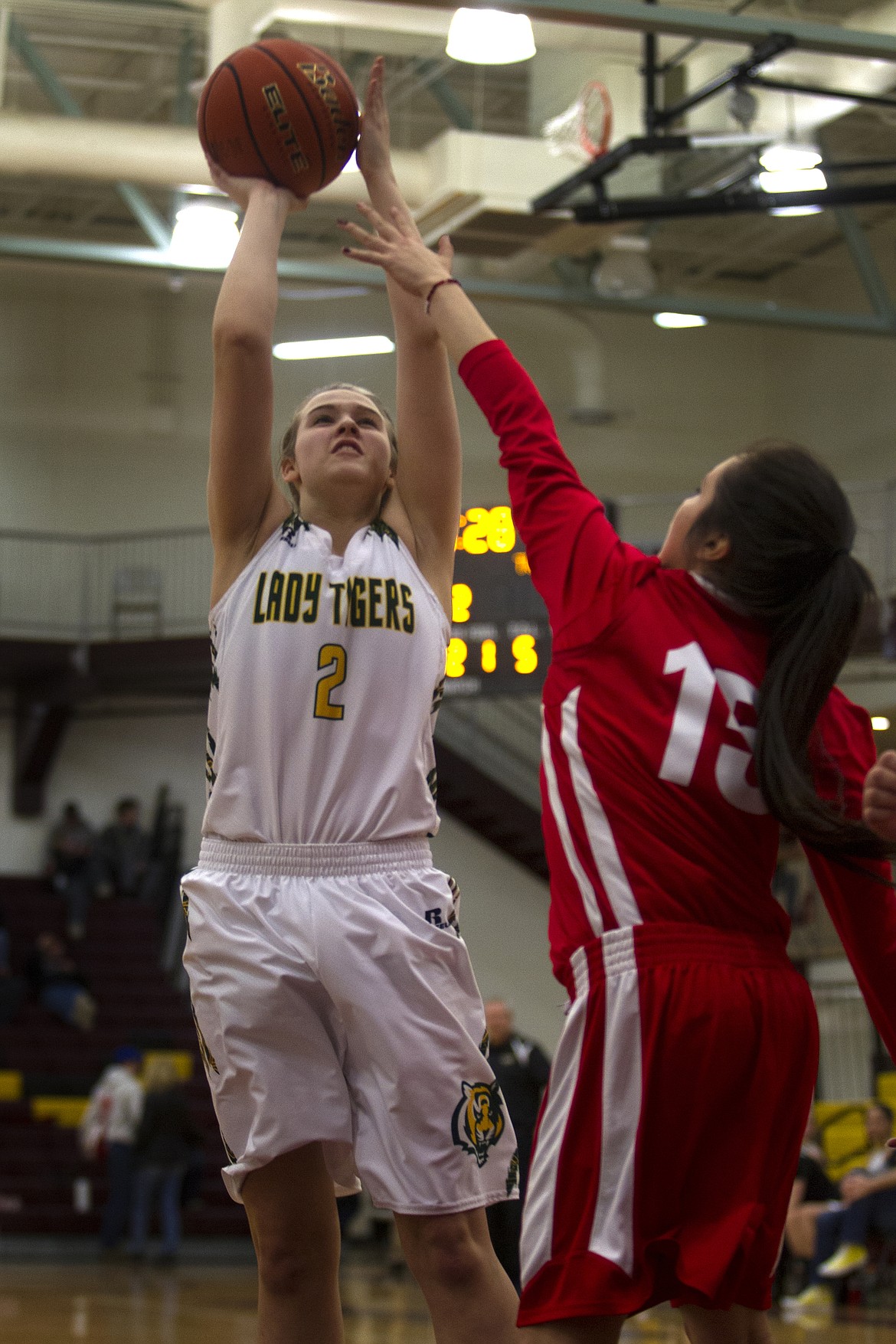 St. Regis forward Courtney Cheesman goes up for  shot over Two Eagle River defender Naomi Stevens at the District 14C Tournament Thursday. (Jeremy Weber/Lake County Leader).