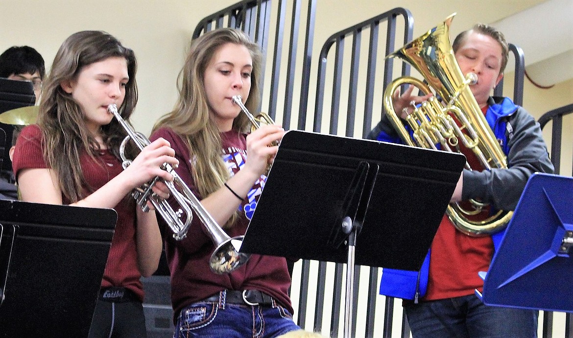 Clark Fork Mountain Cat pep band members Sorren Reese, Sam Clevenger, and Jacob Lapinski, play during the District 13C Tournament in Frenchtown last weekend. (Kathleen Woodford/Mineral Independent).