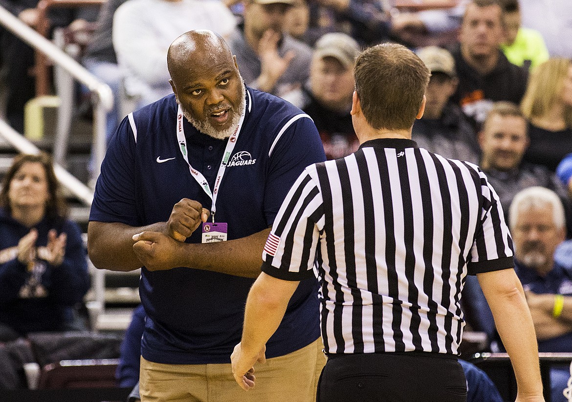 LOREN BENOIT/PressGenesis Prep Head Coach Marsell Colbert discusses a foul with an official.