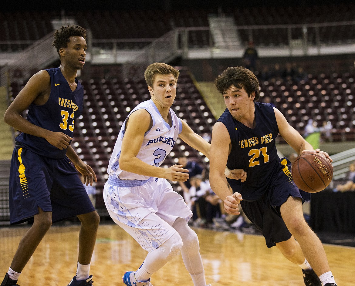 LOREN BENOIT/PressJunior Williams (21), of Genesis Prep, dribbles the ball around Dietrich defender