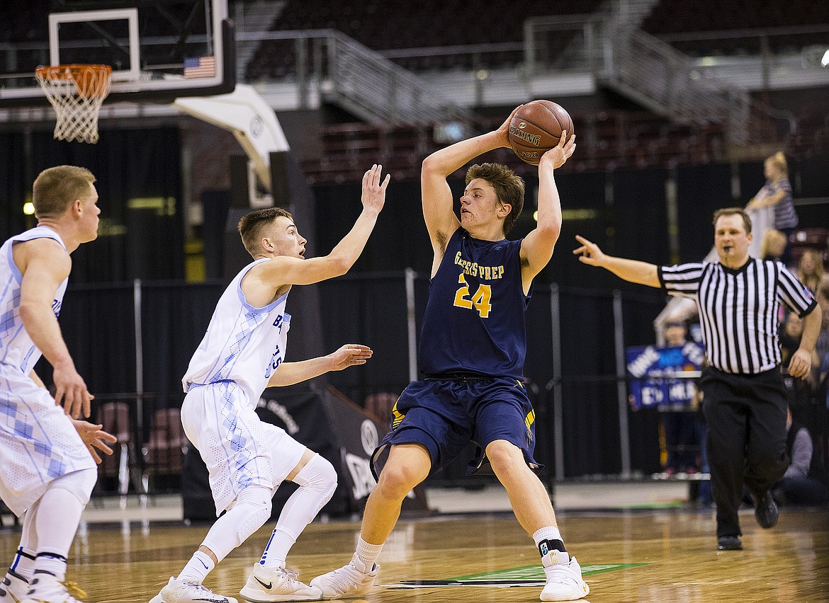 LOREN BENOIT/PressDietrich defenders apply pressure to Genesis Prep guard Jonny Hillman (24) during the 1A DII championship game on Saturday at the Ford Idaho Center in Nampa.