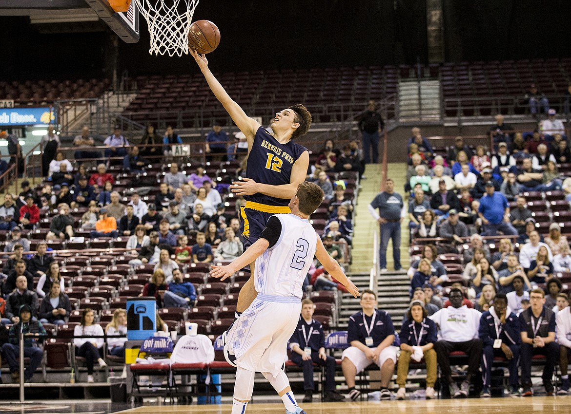 LOREN BENOIT/Press

Genesis Prep guard Max Reidt speeds by Dietrich&#146;s Kaden  Tew for a layup.