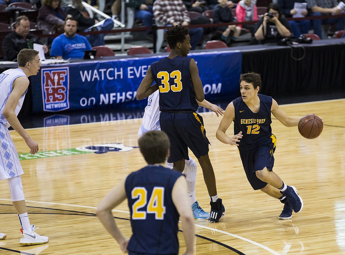 LOREN BENOIT/PressStephane Manzi (33), of Genesis Prep, sets up a screen as  Max Reidt (12) drives into the Dietrich defense.