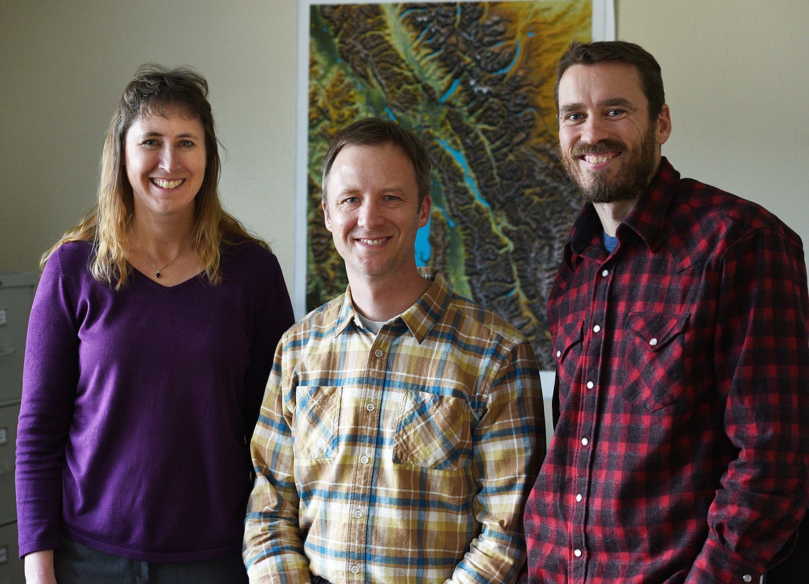 THE STAFF of the Flathead Land Trust (from left), Laura Katzman, Paul Travis and Ryan Hunter, at their Kalispell office on Wednesday, March 8, 2017. (Aaric Bryan/This Week in the Flathead)