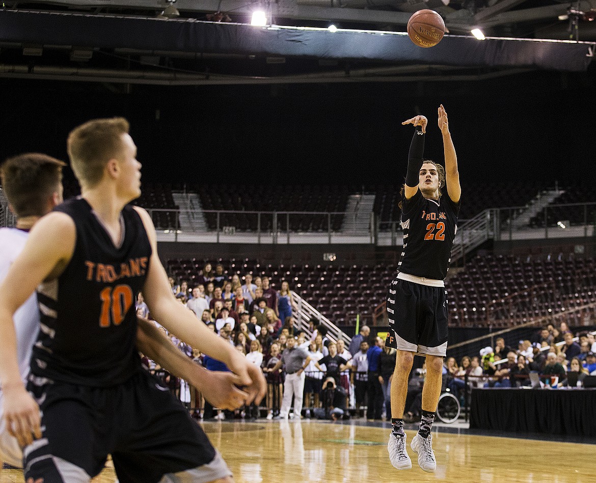 LOREN BENOIT/PressJake Pfennigs, of Post Falls, shoots a three-pointer in the seconds of the 5A state semifinal game against Centennial High School Friday night at the Ford Idaho Center.