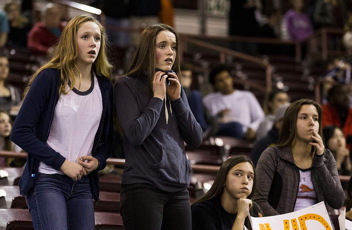 LOREN BENOIT/PressPost Falls fans watch Centennial High School basketball players celebrate their 72-61 win against Post Falls Friday night to advance to the title game on Saturday. Post Falls will battle Lewiston for third place.