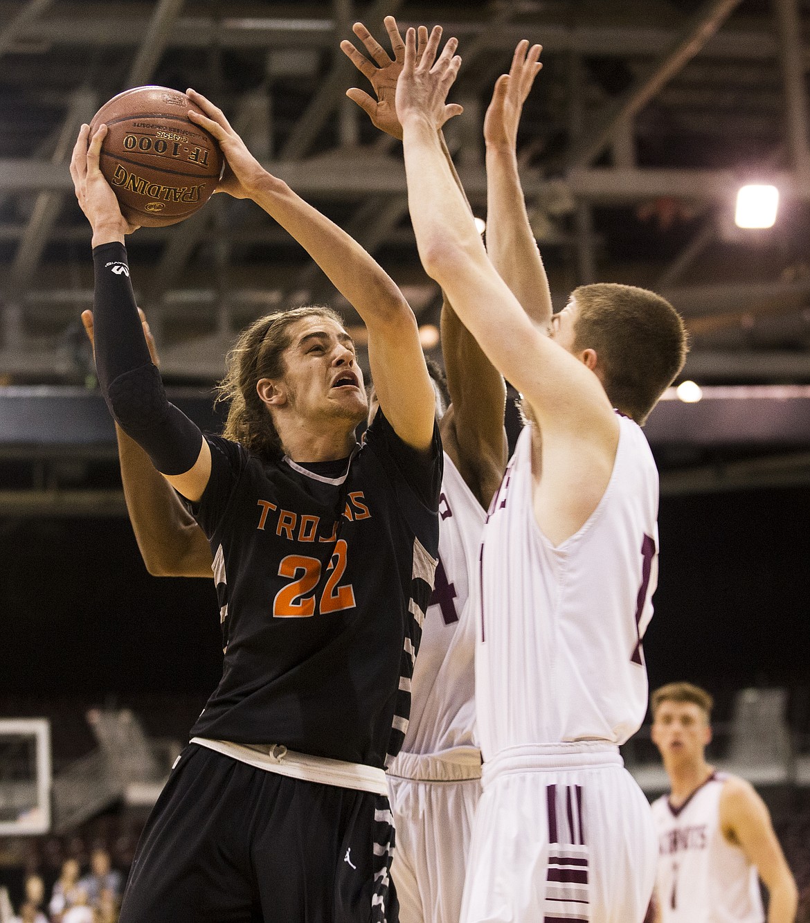 LOREN BENOIT/PressPost Falls' Jake Pfennigs goes for a layup during the second half of the 5A state tournament semifinal game Friday night at the Ford Idaho Center.