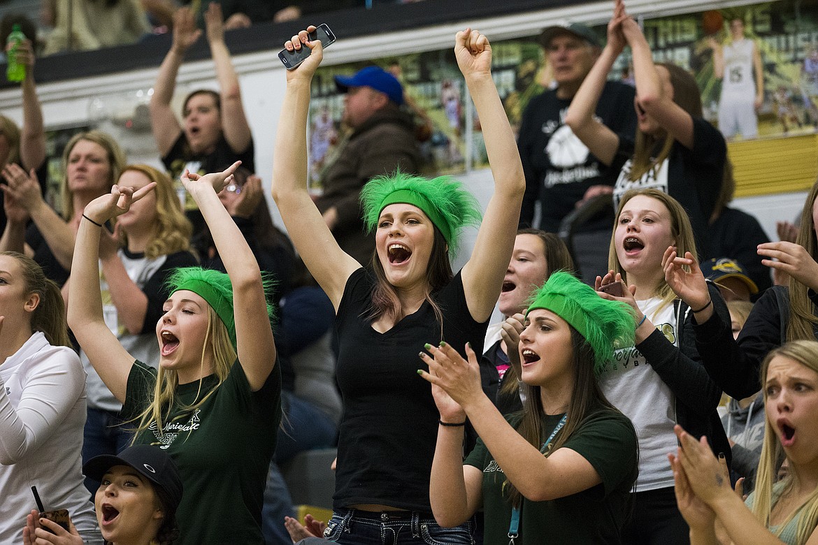 LOREN BENOIT/PressThe St. Maries High School student section erupts after a three-pointer during the second half of the 2A state semifinal game at Capital High School. Ririe defeated St. Maries 50-33.