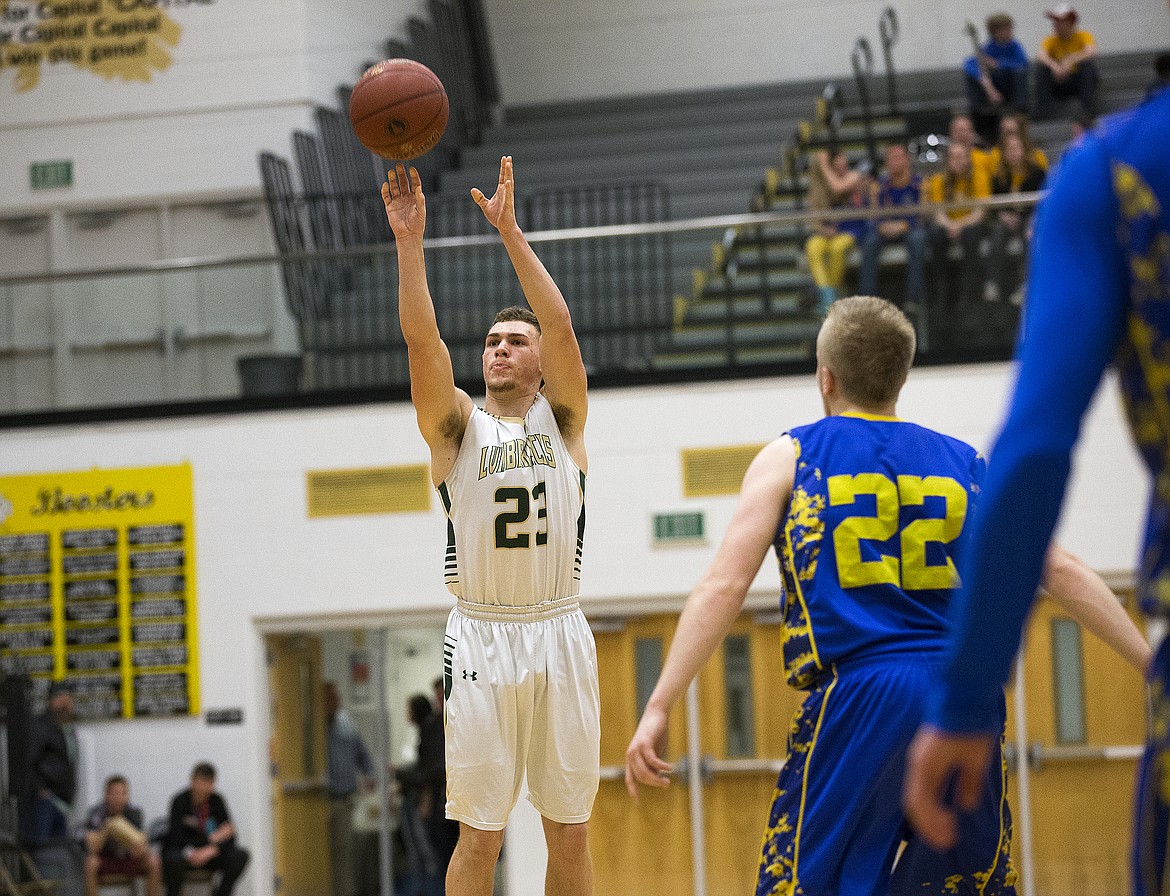 LOREN BENOIT/PressDakota Wilson (23), of St. Maries shoots a three from beyond the arc during the 2A state semifinal game at Capital High School. Ririe defeated St. Maries 50-33.