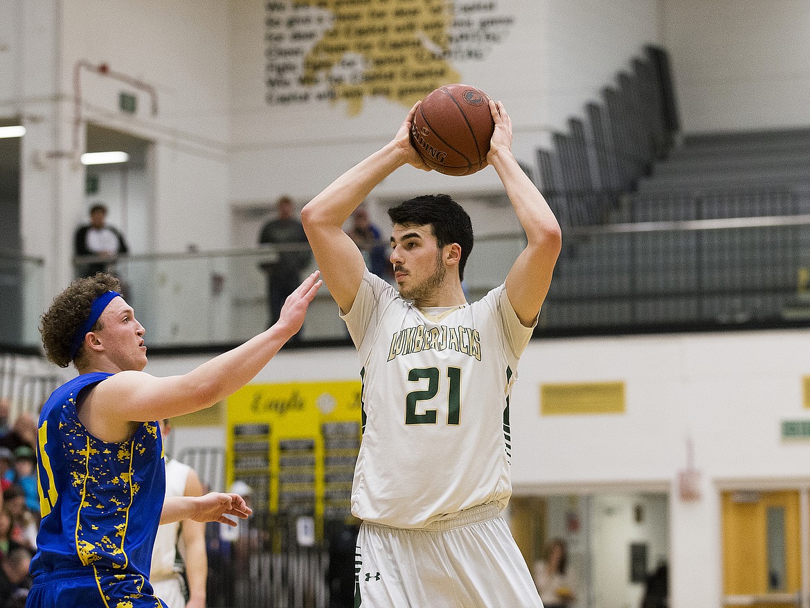 LOREN BENOIT/PressRyker Parkinson, of St. Maries, looks for a teammate to pass to during the 2A state semifinal game at Capital High School. Ririe defeated St. Maries 50-33.