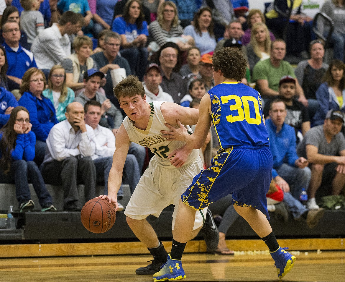 LOREN BENOIT/PressKiefer Gibson (12), of St. Maries, drives the ball around Ririe's Dylan Anglesey.