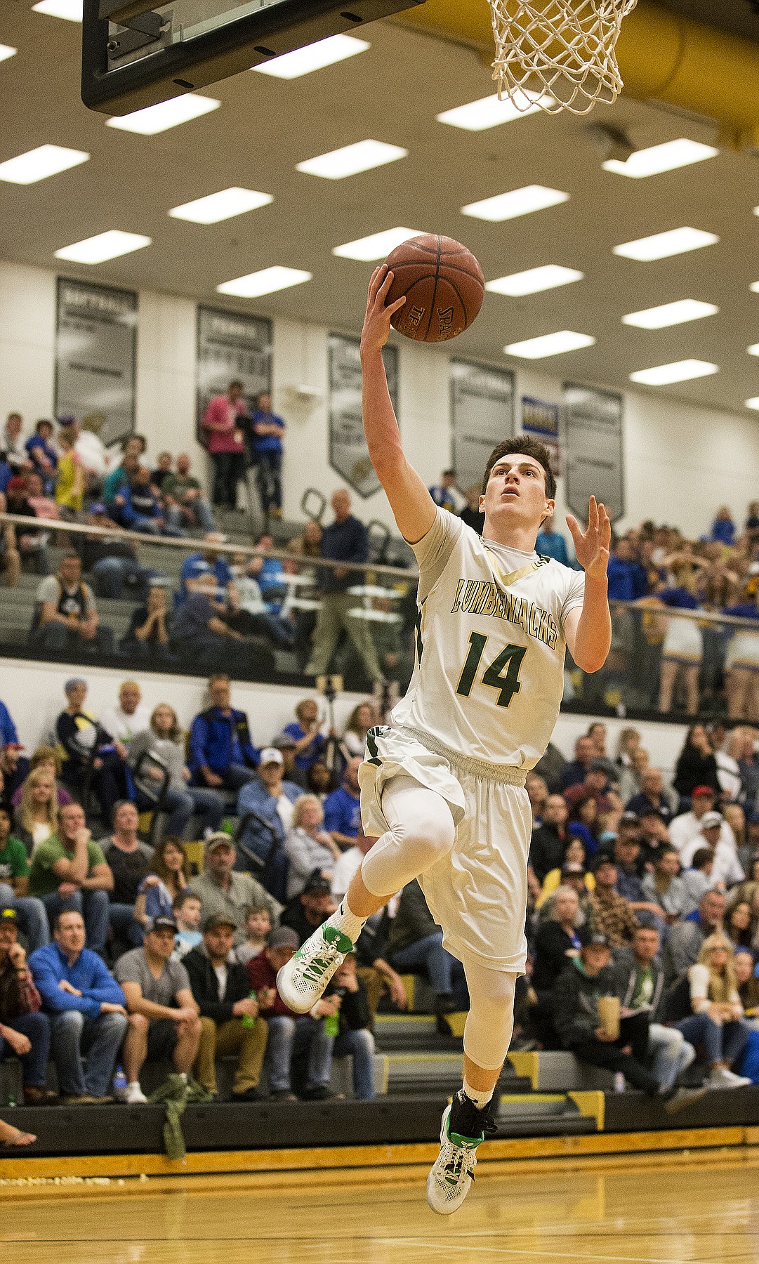 LOREN BENOIT/PressSt. Maries' Jake Sieler goes for a layup after a fast break against Ririe during the 2A state semifinal game at Capital High School. Ririe defeated St. Maries 50-33.