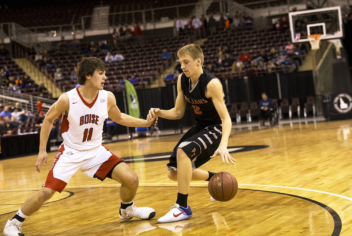 LOREN BENOIT/Press

Colby Gennett, of Post Falls creates space between him and Boise defender Emmett Plummer during the first half of Thursday night&#146;s state 5A tournament game at the Ford Idaho Center in Nampa.