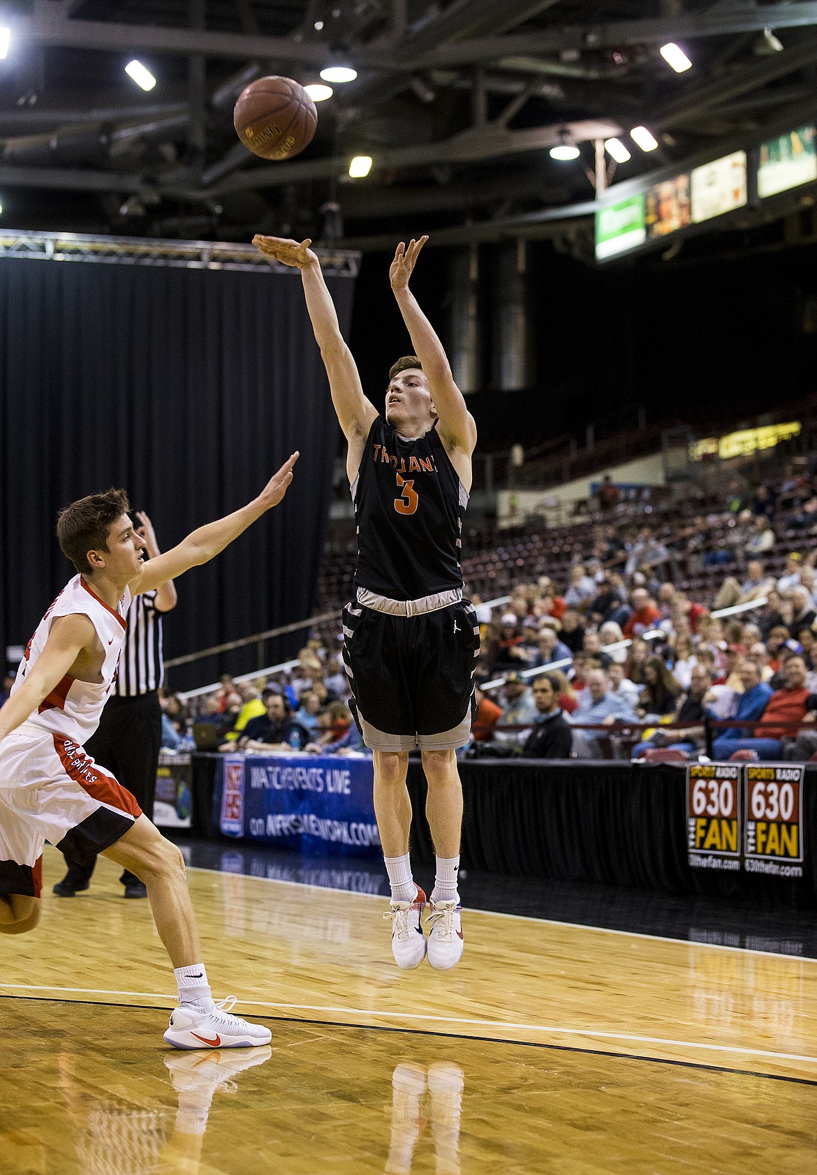LOREN BENOIT/PressDrake Thompson of Post Falls shoots a two pointer just inside the three point arc.