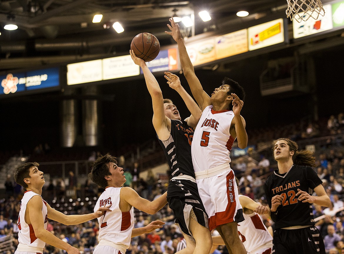 LOREN BENOIT/Press

Boise&#146;s Lucas Centeno (5) tries to block Tanner McCliment-Call&#146;s shot in the first half of Thursday night&#146;s state 5A tournament game at the Ford Idaho Center in Nampa.