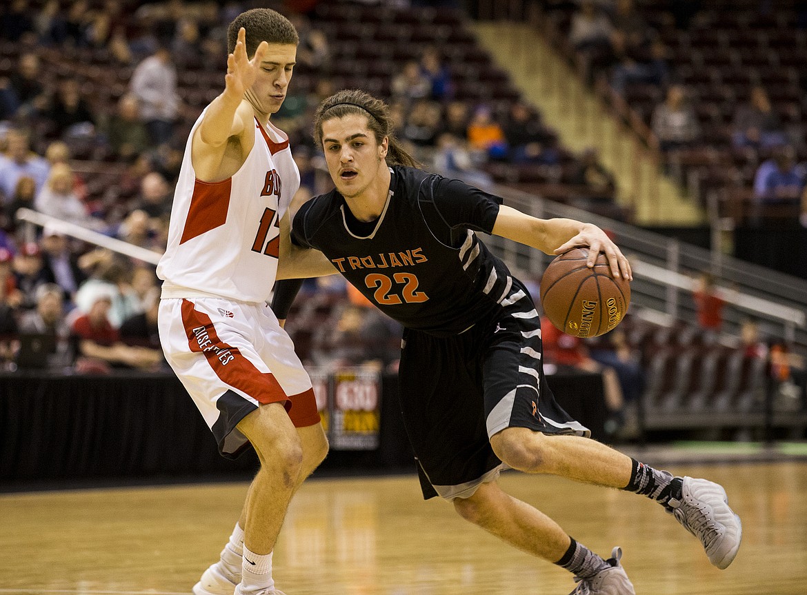 LOREN BENOIT/Press

Post Falls senior Jake Pfennigs dribbles by Boise&#146;s Josh Martinez in the first half of Thursday night&#146;s state 5A tournament game at the Ford Idaho Center in Nampa.