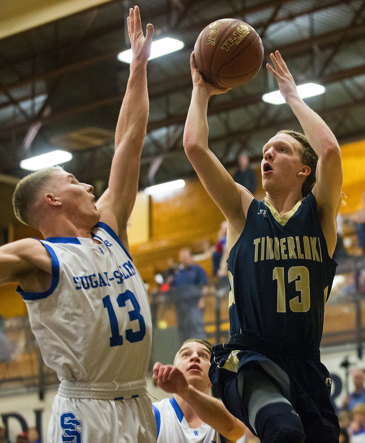 LOREN BENOIT/Press

Timberlake guard Dock Sommers shoots a two-pointer over Sugar-Salem&#146;s Parker Miller in game 1 of the state 3A boys basketball tournament Thursday at Meridian High School.