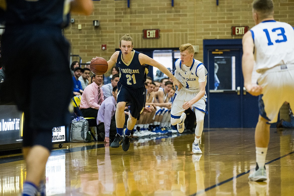 LOREN BENOIT/PressTimberlake's Brayden Menti dribbles the ball down court against Sugar-Salem in game 1 of the state 3A boys basketball tournament Thursday at Meridian High School.