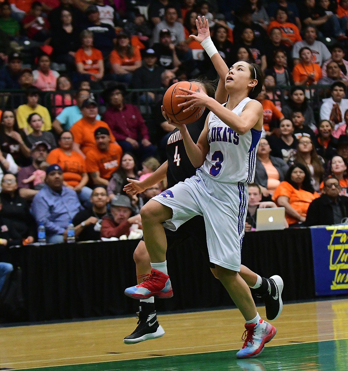 Columbia Falls' Dani Douglas with a layup after a steal against Hardin in the state A finals in Butte Saturday. (Chris Peterson photo)