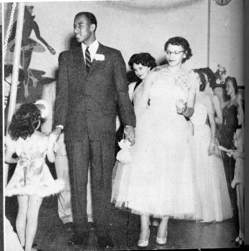 In the 1953 yearbook, Zip Rhoades and Raella Kelley are pictured leading the processional at the senior dance at Flathead County High School. Zip was senior-class president and had met Raella when he moved to Kalispell in the summer of 1952. (Courtesy Jerry Siderius)